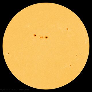 This image from NASA's Solar Dynamics Observatory was captured on Jan. 13, 2013, at 8:13 p.m. EST. At the center sits a large cluster of sunspots, dubbed Active Region 11654.