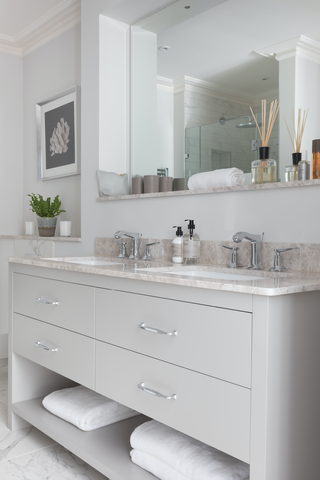 grey toned bathroom scheme with grey vanity and large wall mirrors