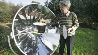 A woman cooking in her garden using a solar oven