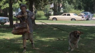 Ouiser with her dog on a leash in Steel Magnolias