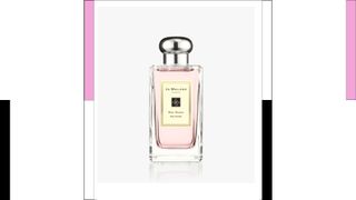 Jo Malone London Red Roses Cologne next to colored columns