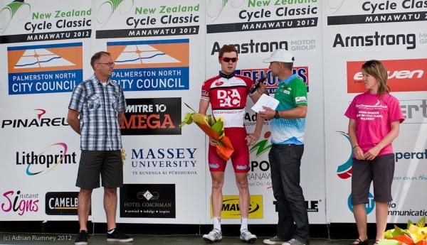 Stage winner Tom Palmer (Drapac) is interviewed on the podium.