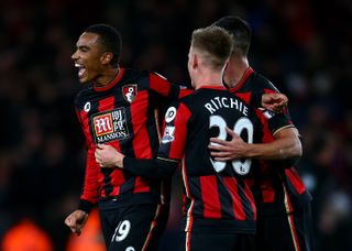 Junior Stanislas celebrates with his Bournemouth team-mates after scoring directly from a corner against Manchester United in December 2015.