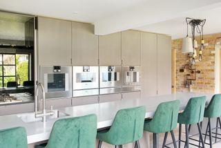 a handleless kitchen in a light colour