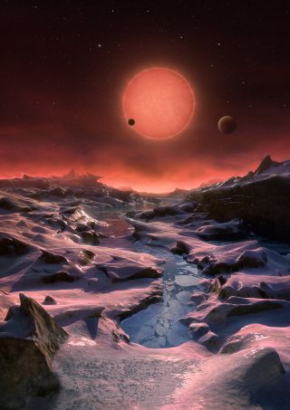 This artist's illustration depicts an imagined view from the surface of one of the three newfound TRAPPIST-1 alien planets. The planets have sizes and temperatures similar to those of Venus and Earth, making them the best targets yet for life beyond our s