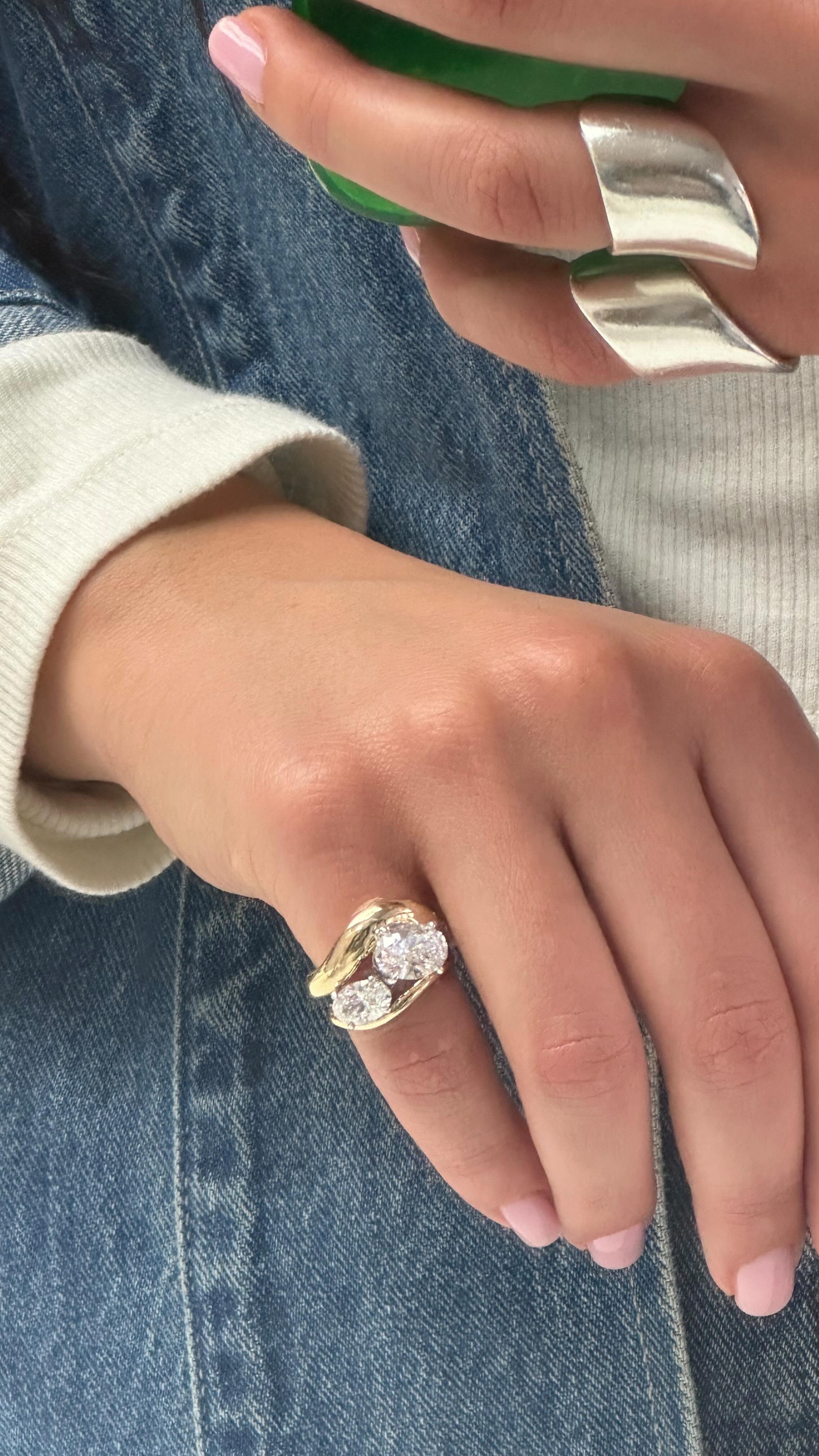 Woman wearing diamond pinkie ring