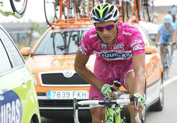 Bennati sprays some pain killer on a sore left calf.