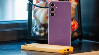 Purple Galaxy S23 FE with Orange case