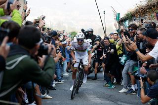 BERGAMO, ITALY - OCTOBER 11: Tadej Pogacar of Slovenia and Team UAE Team Emirates competes in the breakaway while fans cheers during the 119th Il Lombardia 2025 a 241km one day race from Como to Bergamo on October 11, 2025 in Bergamo, Italy. (Photo by Luca Bettini - Pool/Getty Images)