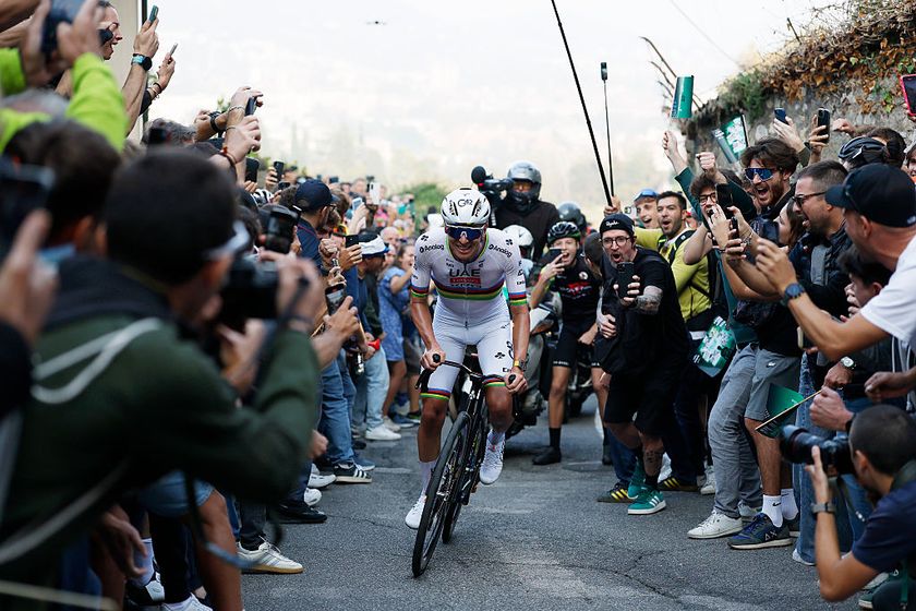 BERGAMO, ITALY - OCTOBER 11: Tadej Pogacar of Slovenia and Team UAE Team Emirates competes in the breakaway while fans cheers during the 119th Il Lombardia 2025 a 241km one day race from Como to Bergamo on October 11, 2025 in Bergamo, Italy. (Photo by Luca Bettini - Pool/Getty Images)