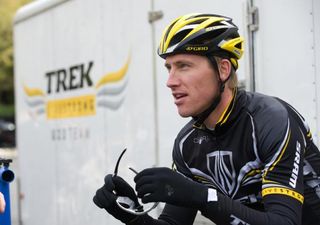 Sport director Axel Merckx gets ready to go. Helmet? Check. Glasses? Check. Trek-Livestrong riders? Check.