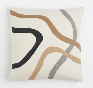 A cotton wave patterned throw pillow