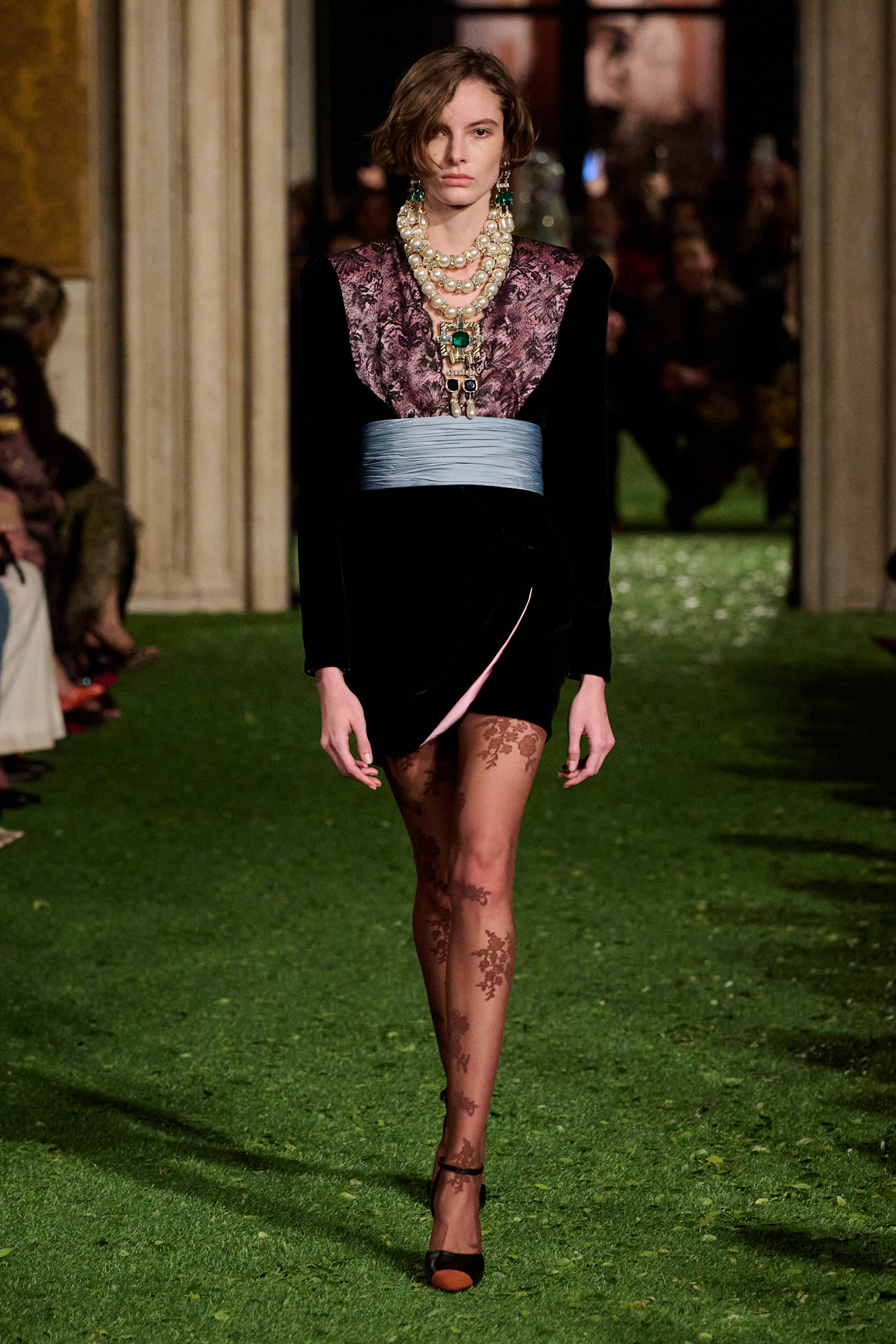 Photos of runway models at Valentino Fall Winter 2026 show.
