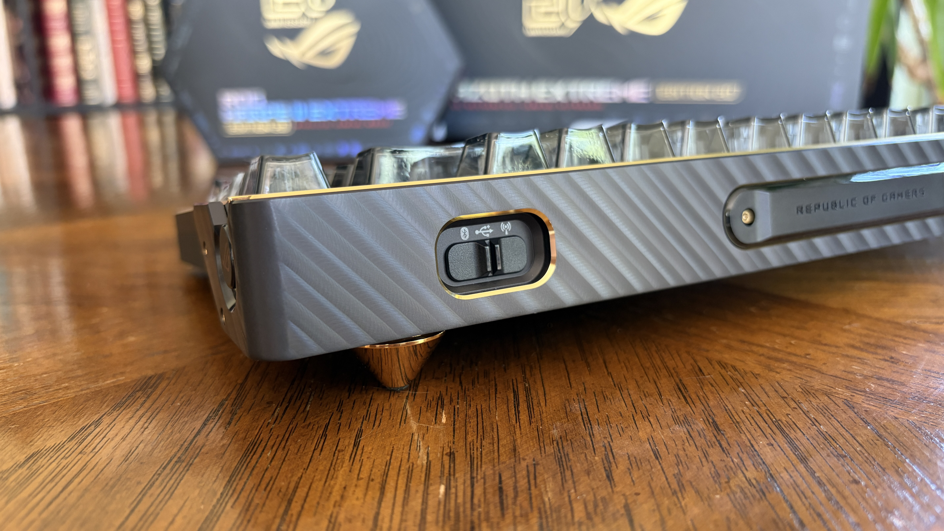 Close-up of an ASUS ROG Azoth Extreme Edition 20 keyboard with a metallic finish and &amp;ldquo;REPUBLIC OF GAMERS&amp;rdquo; text.
