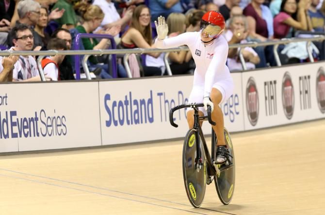 Rebecca James salutes the crowd after Britain finished first in team sprint qualification