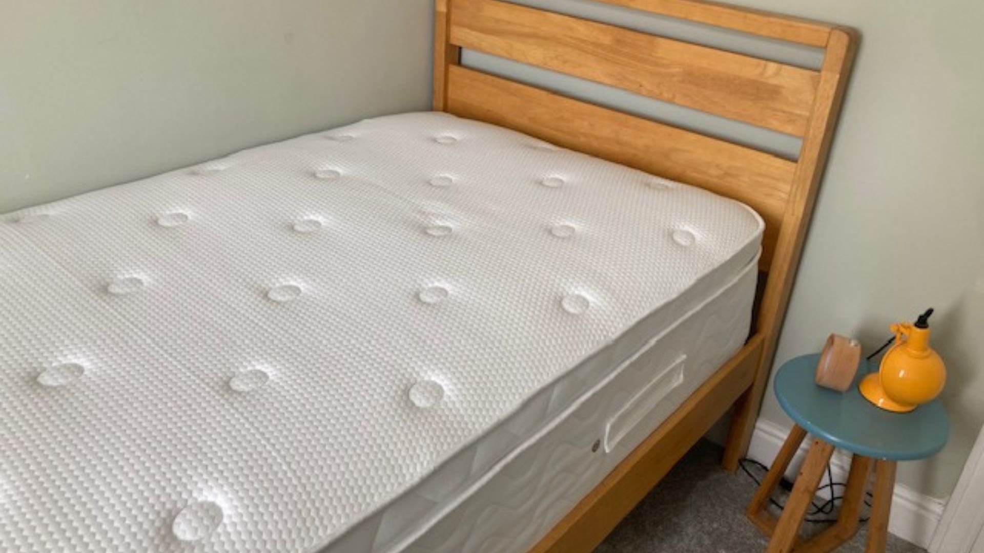 Evermore 1500 Pocket Spring Foam Hybrid Mattress in our tester, Linda's bedroom on a wooden bed frame