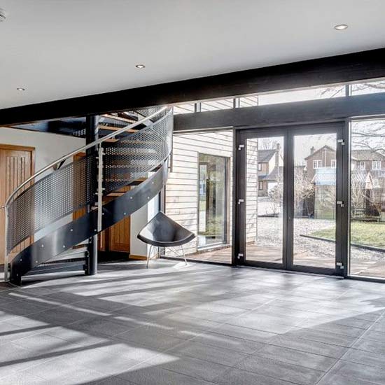 glass door with stairs and chair