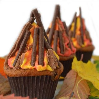cupcakes with chocolate matchsticks and orange icing