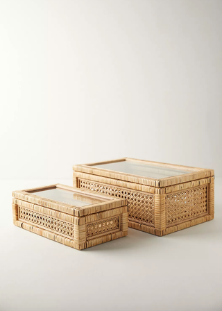 two rattan boxes with glass lids