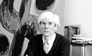 A black & white photo of Andy Warhol
