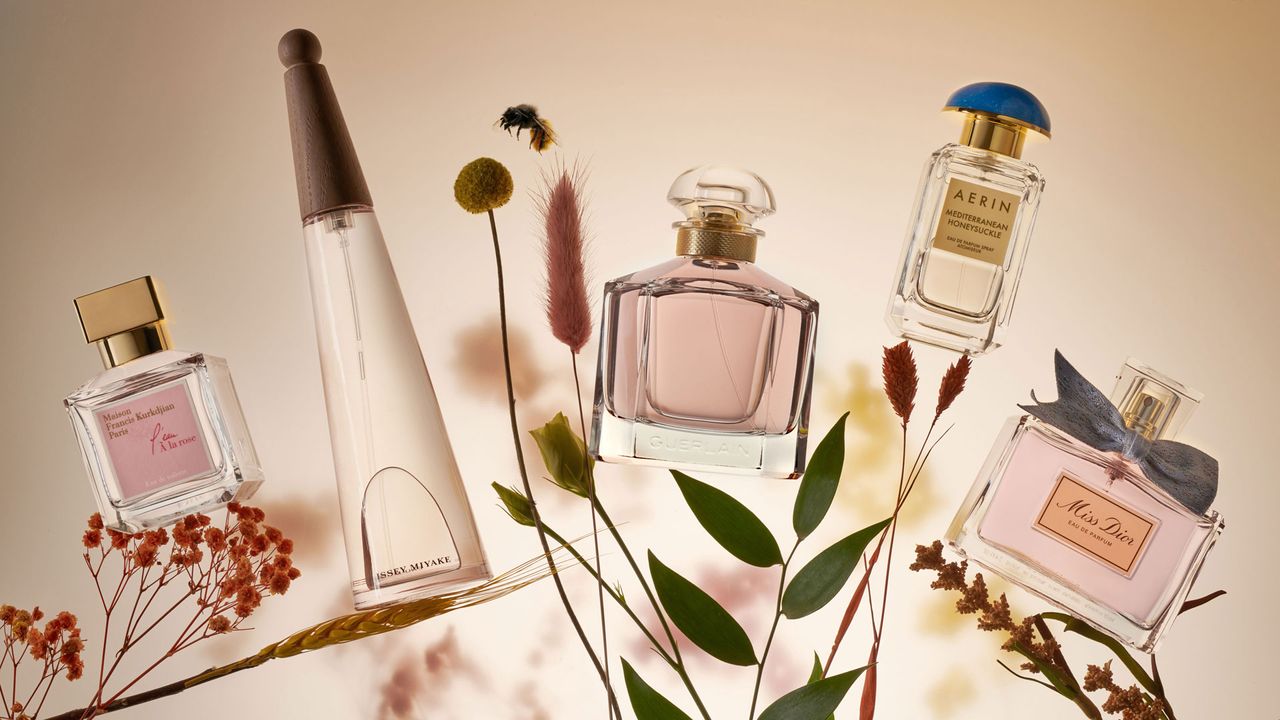 Floral perfumes: Maison Francis Kurkdjian L&#039;eau A La Rose, Issey Miyake L&#039;eau D&#039;Issey Pivone, Guerlain Mon Guerlain, Aerin Mediterranean Honeysuckle, Dior Miss Dior shot on foliage with a buzzing bee