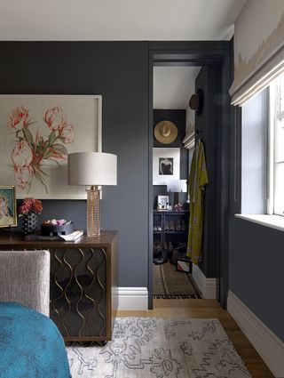 Grey walls and rug, brown cabinet
