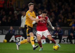 Gabriel Martinelli of Arsenal and Nathan Collins of Wolverhampton Wanderers in action during the Premier League match between Wolverhampton Wanderers and Arsenal FC at Molineux on November 12, 2022 in Wolverhampton, United Kingdom.