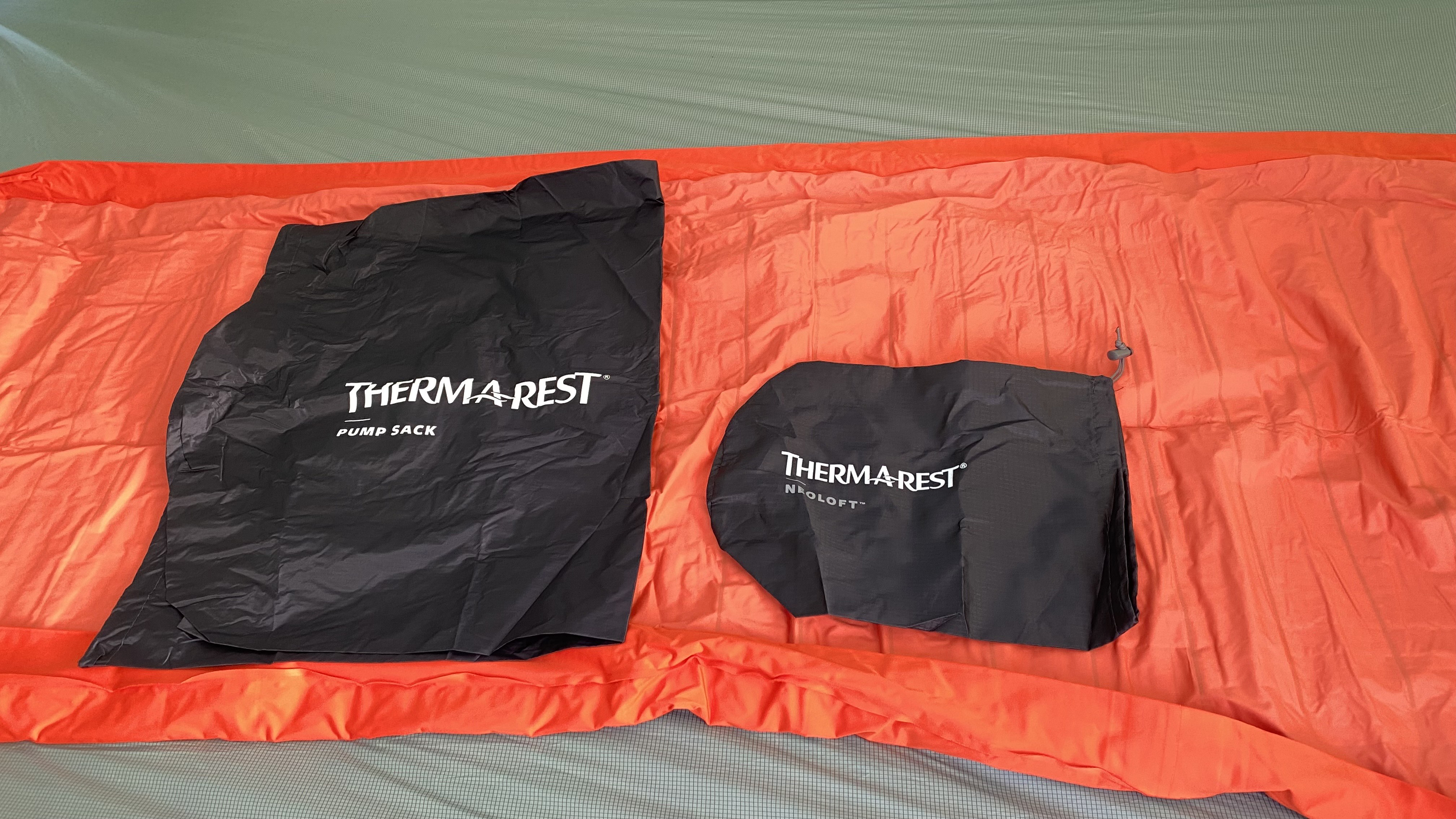 Therm-a-Rest NeoLoft sleeping pad, pictured deflated with pump bag and stuff sack
