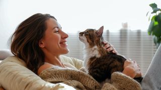 Woman cuddling new cat