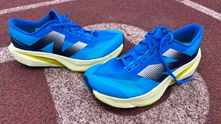 New Balance FuelCell Rebel V4 running shoes on running track