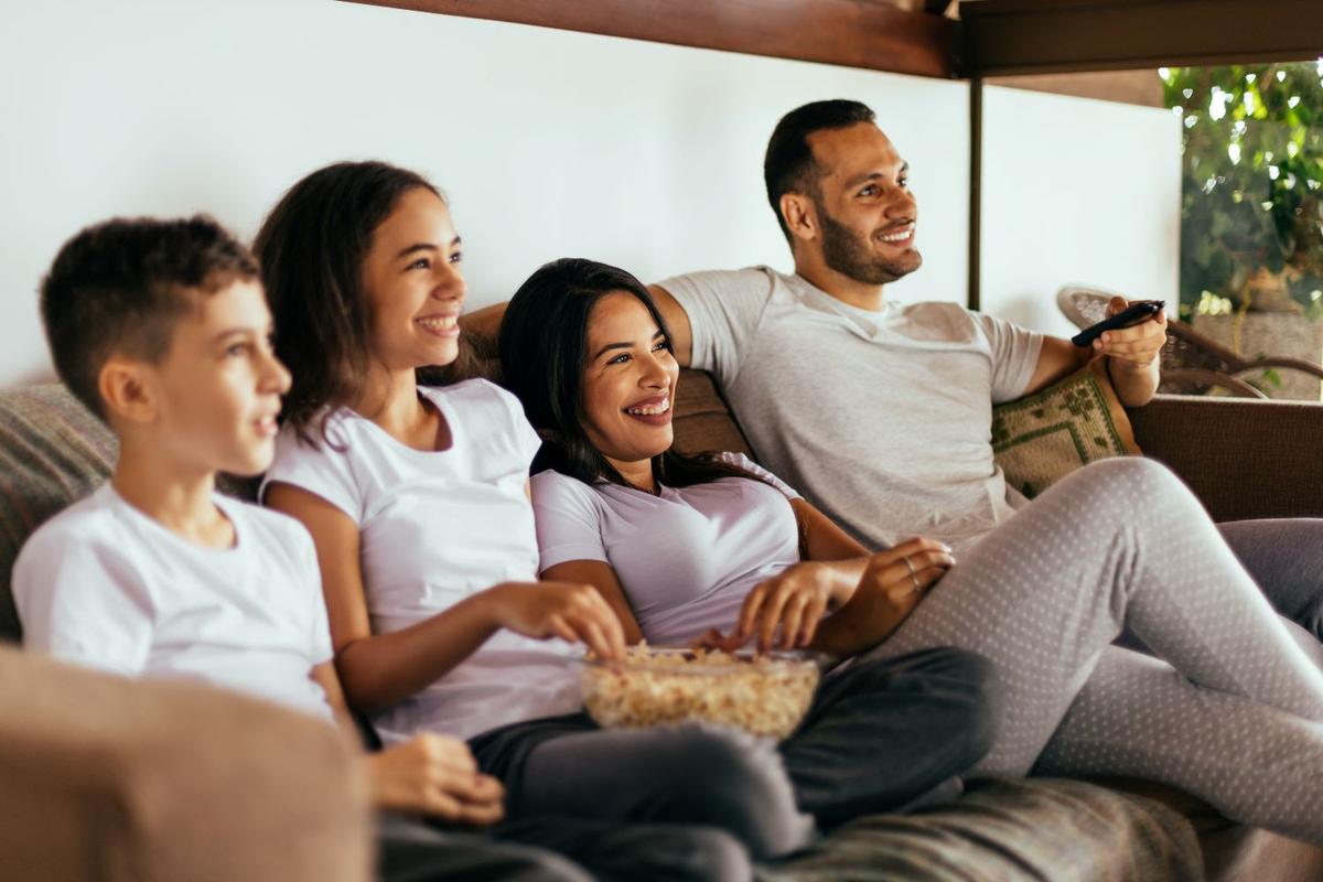 Hispanic/Latine family watching TV