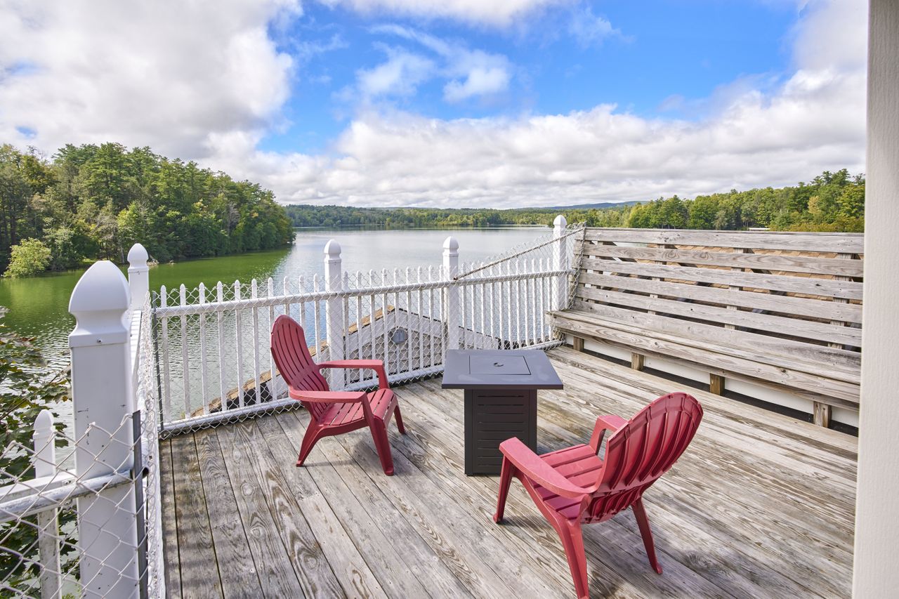A rooftop deck with fencing