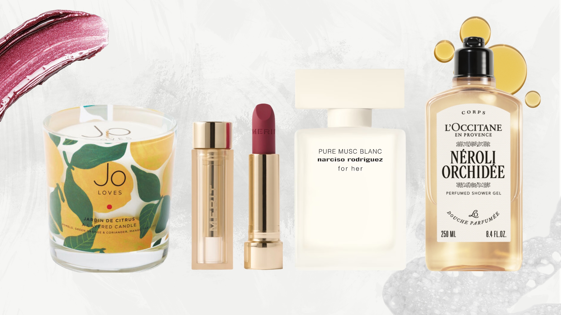 Collage of new beauty launches in February 2026 (L-R) Jo Loves candle, Merit Beauty lipstick, Narciso Rodriguez perfume and L'Occitane shower oil, on a white marble background with a mauve lipstick swatch, oil drops and white bubbles