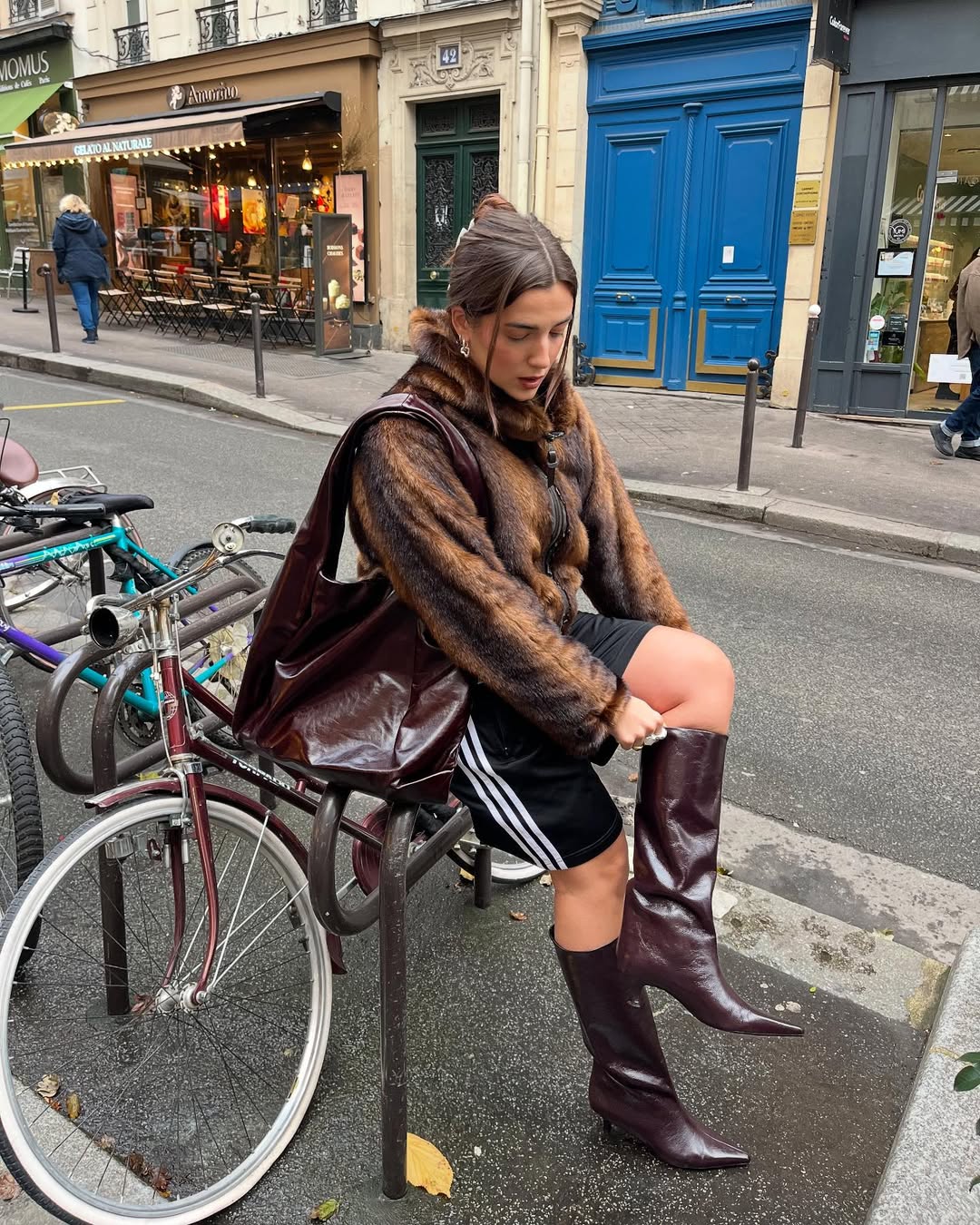 woman wearing brown maroon color trend fall 2025
