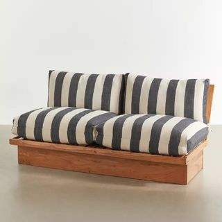 A small outdoor sofa with wide stripe