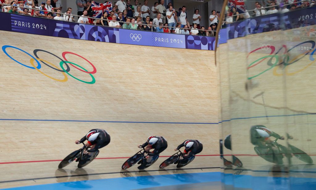 Britain's Ed Owen Lowe, Britain's Hamish Turnbull and Britain's Jack Carlin compete in the men's track cycling team sprint final for gold of the Paris 2024 Olympic Games at the Saint-Quentin-en-Yvelines National Velodrome in Montigny-le-Bretonneux, south-west of Paris, on August 6, 2024. (Photo by Thomas SAMSON / AFP)