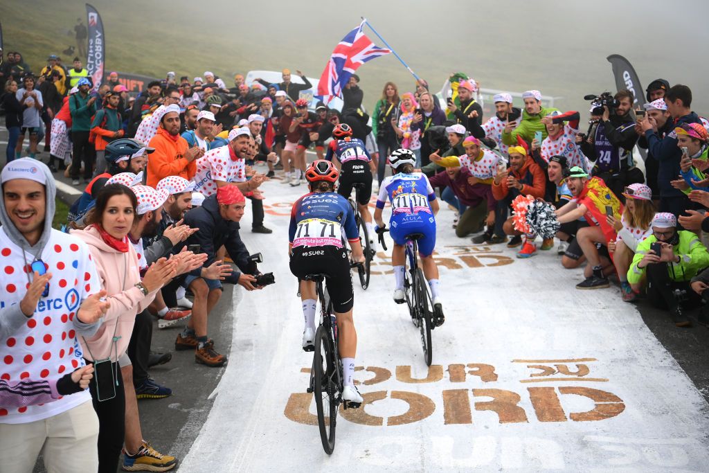 Fans cheer on riders on the climb