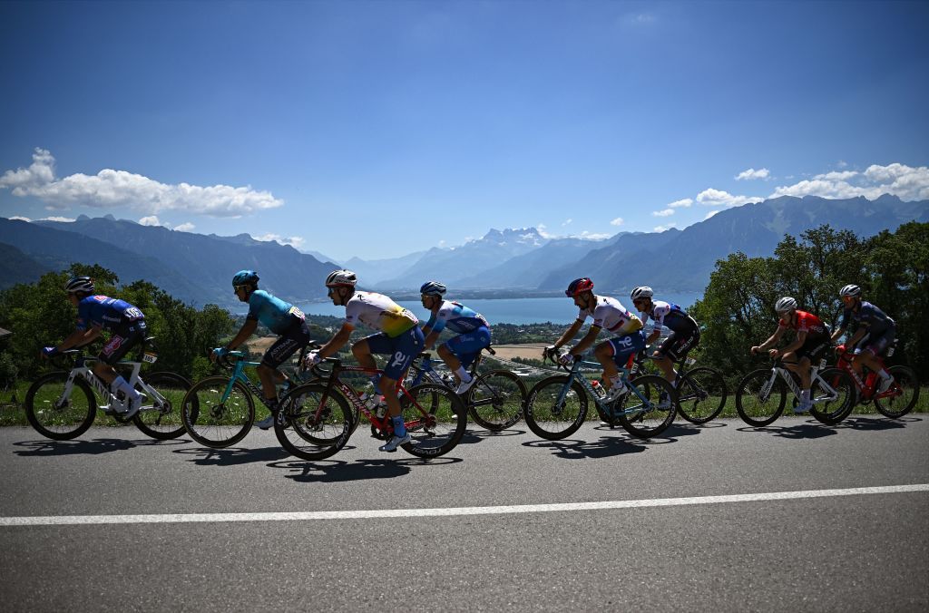 The pack of riders cycles during the 9th stage of the 109th edition of the of the Tour de France cycling race 1929 km between Aigle in Switzerland and Chatel Les Portes du Soleil in the French Alps on July 10 2022 Photo by AnneChristine POUJOULAT AFP Photo by ANNECHRISTINE POUJOULATAFP via Getty Images