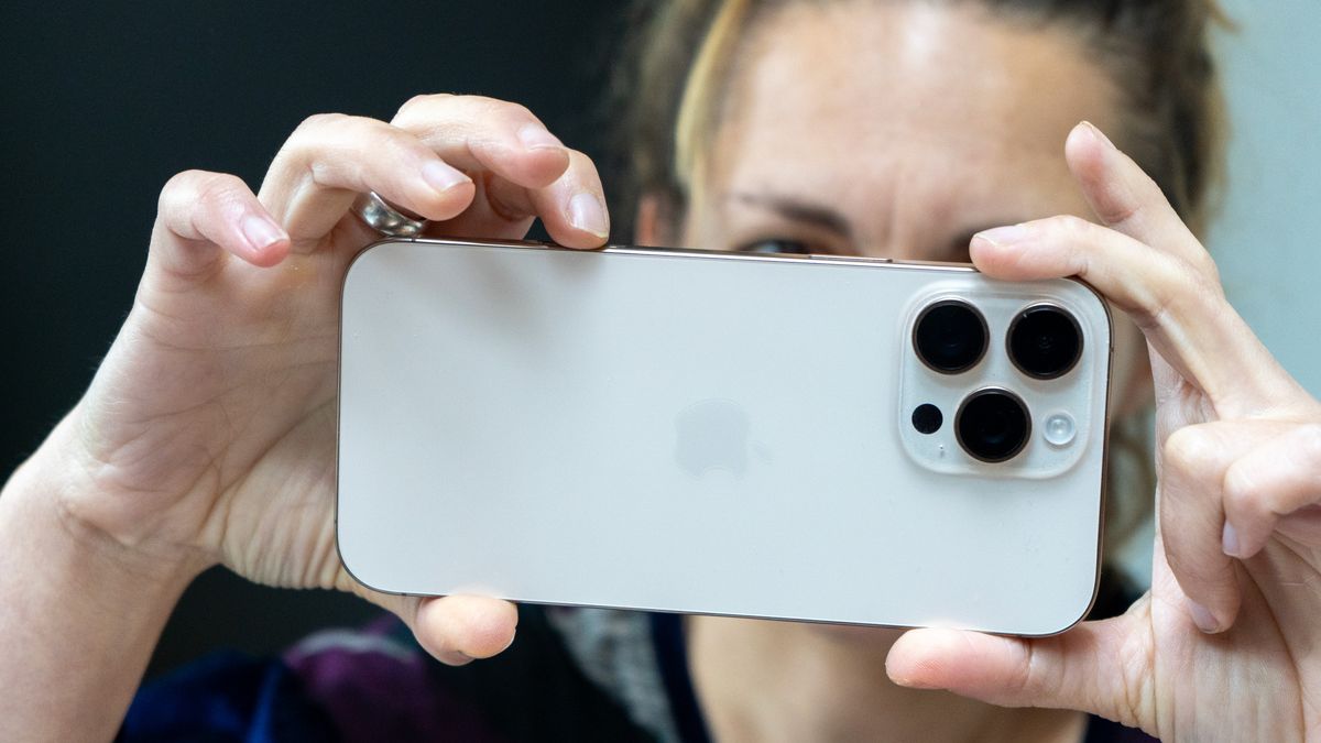 Woman taking a picture with the iPhone 16 Pro Max