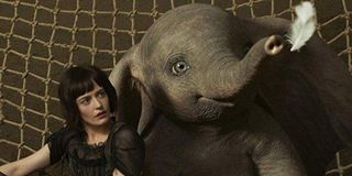 Dumbo Eva Green sits on the net with Dumbo, staring at a feather