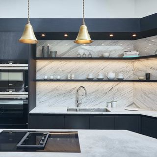 black kitchen with backlit shelving
