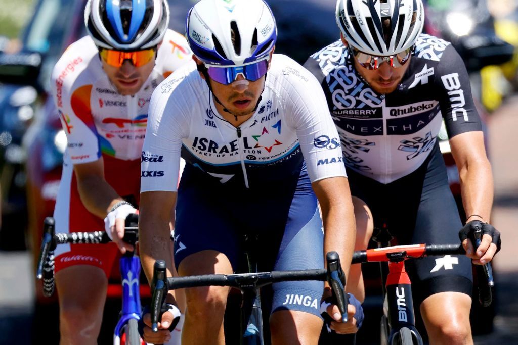 Team Israel Start Up Nations Omer Goldstein of Israel C Team Total Energies Pierre Latour of France L and Team Qhubeka Assos Sean Bennett of US ride in a breakaway during the 13th stage of the 108th edition of the Tour de France cycling race 219 km between Nimes and Carcassonne on July 09 2021 Photo by Thomas SAMSON AFP Photo by THOMAS SAMSONAFP via Getty Images