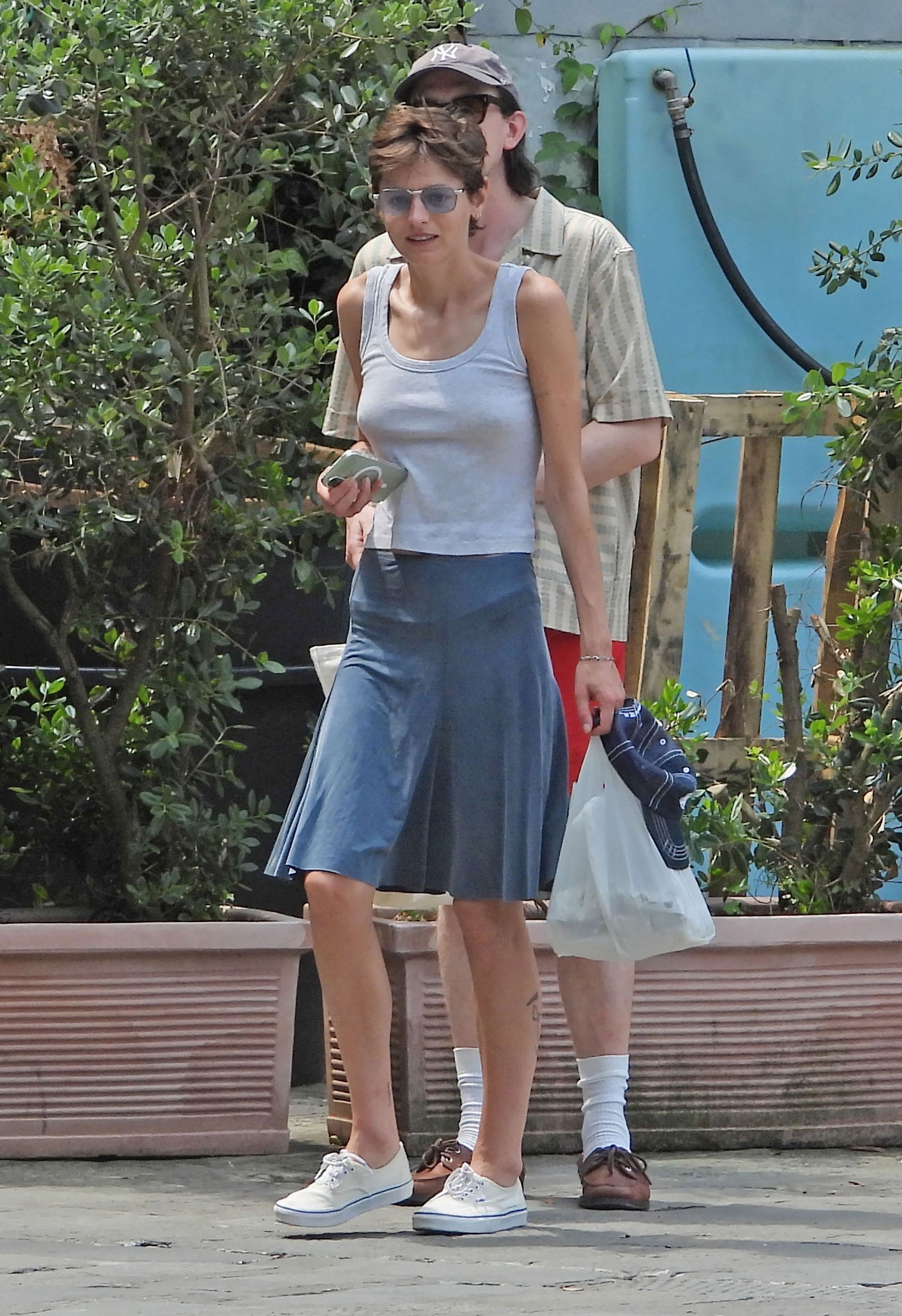 Emma Corrin wears a tank top in Portofino