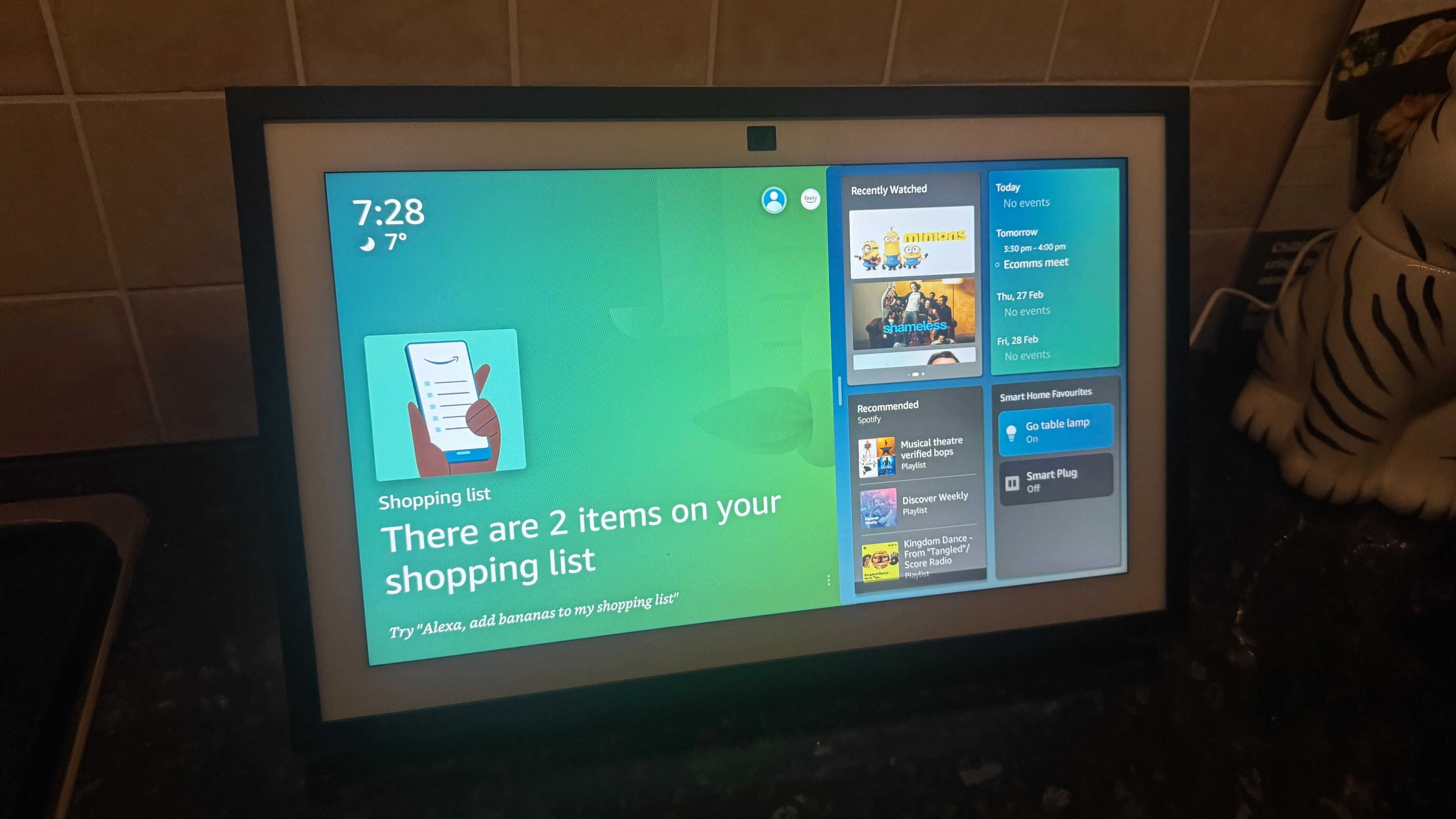 Amazon Echo Show displaying home screen with shopping lists next to widgets menu.