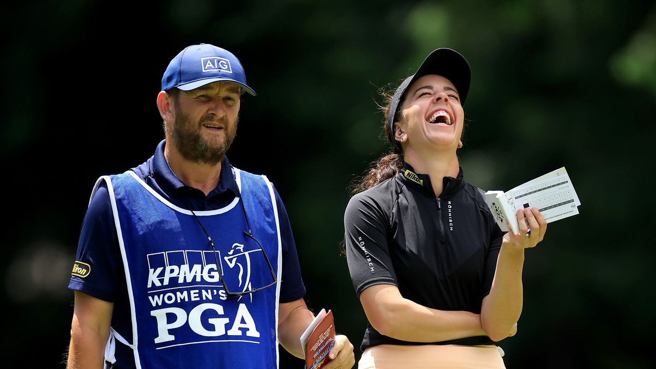 Georgia Hall and her caddie Joe Miller share a light-hearted moment at the 2024 KPMG Women&#039;s PGA Championship