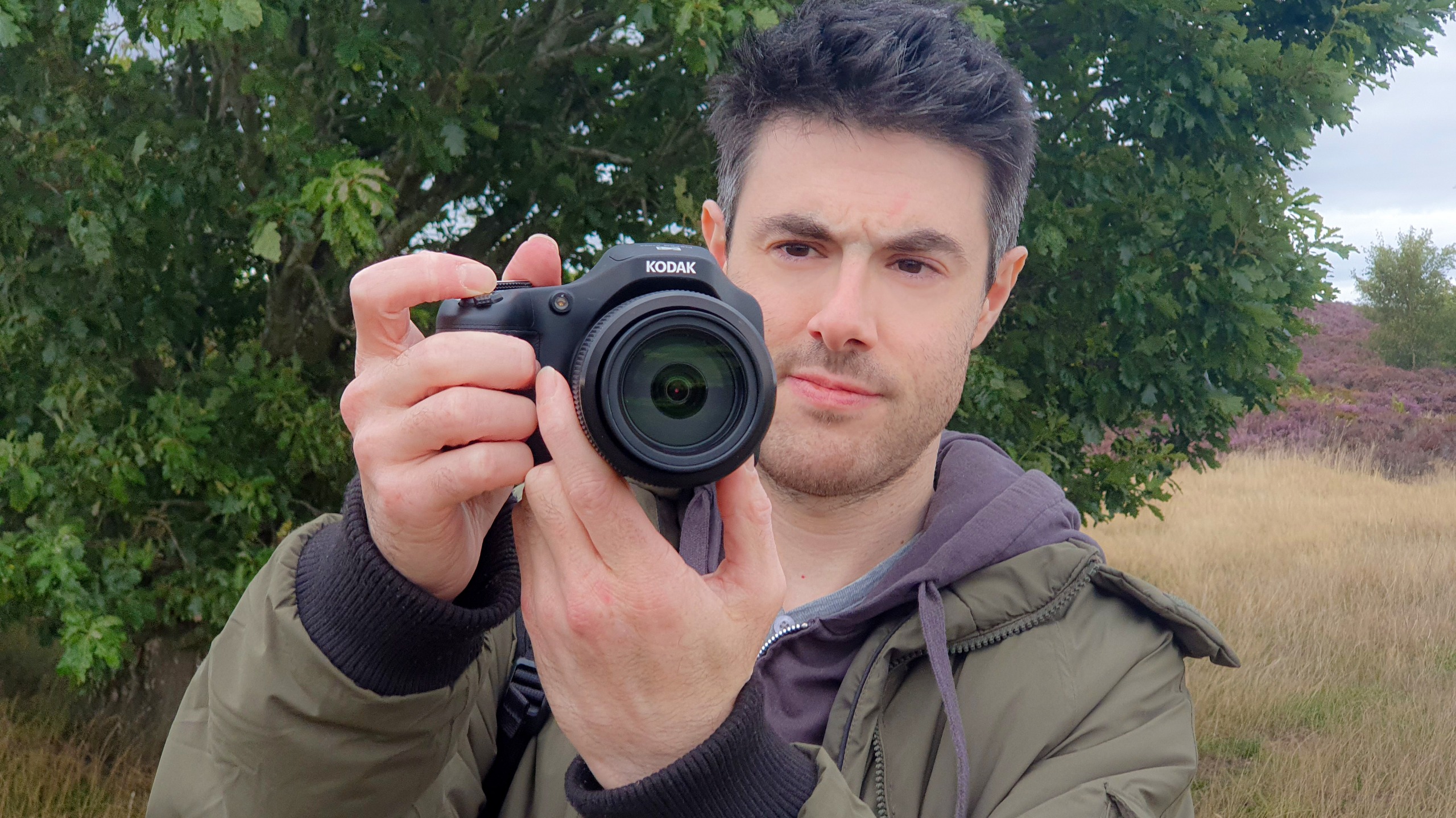 A man with the Kodak PixPro AZ653 bridge camera