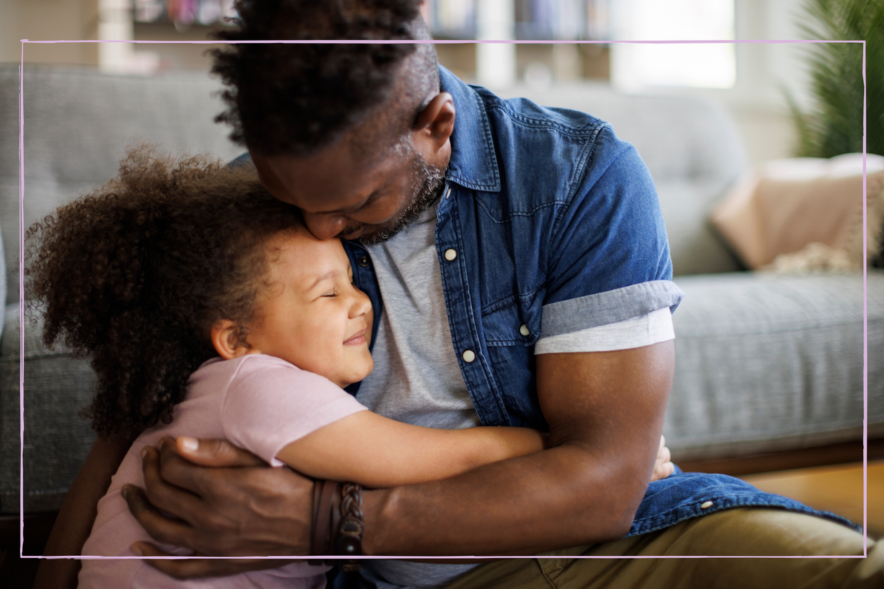 Father and daughter embracing at home