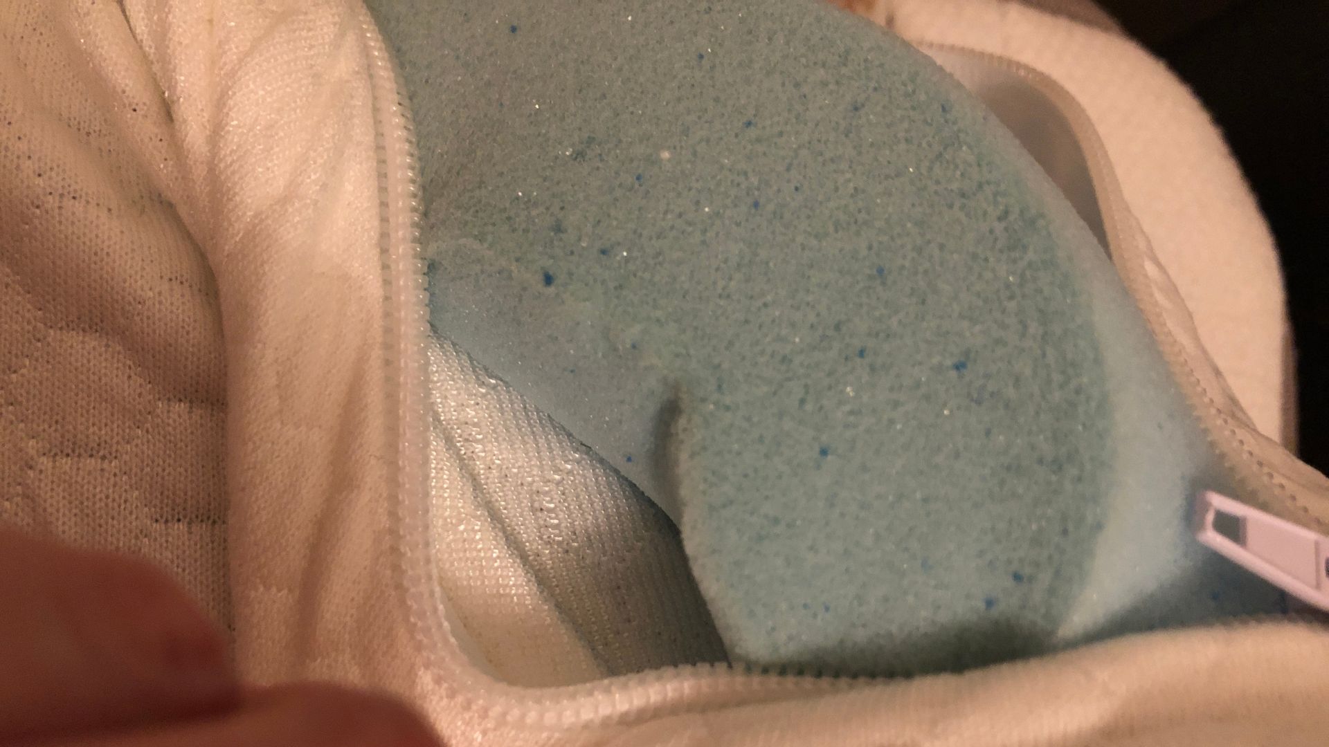 The interior of an unzipped Panda London Memory Foam Mattress Topper.