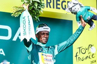 Eritrean Biniam Girmay Hailu of Intermarche-Wanty pictured on the podium after stage 15 of the 2024 Tour de France cycling race, from Loudenvielle to Plateau de Beille, France (107,7 km), on Sunday 14 July 2024. The 111th edition of the Tour de France starts on Saturday 29 June and will finish in Nice, France on 21 July. BELGA PHOTO DAVID PINTENS (Photo by DAVID PINTENS / BELGA MAG / Belga via AFP)