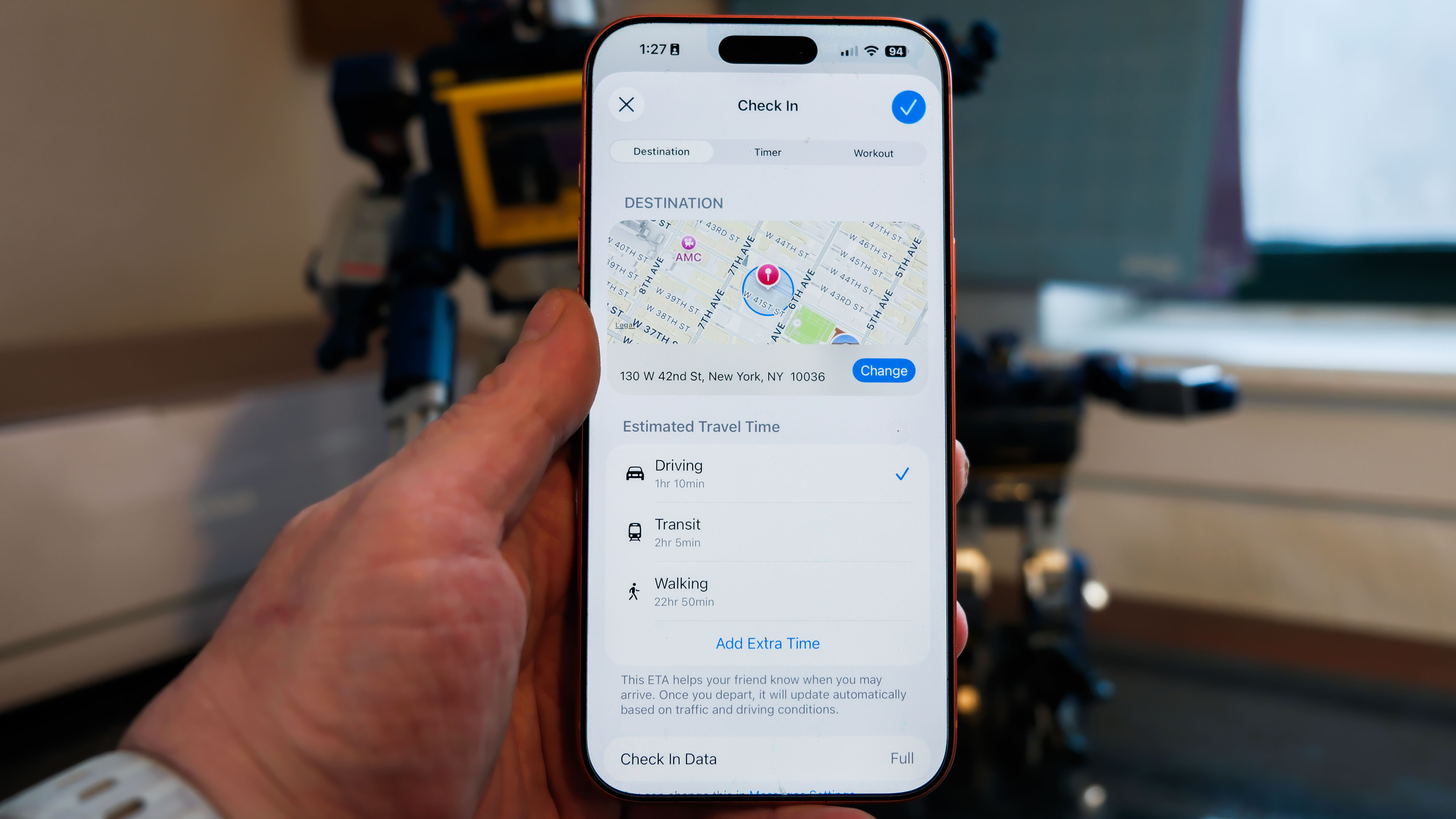 Apple iPhone 16 Pro Max in orange showing various Apple Messages features including sending check-ins, Apple Cash, and doodles